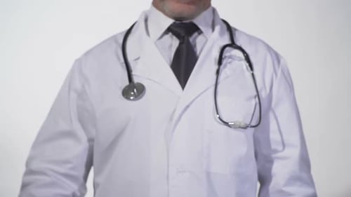 Doctor holding health insurance sign in studio