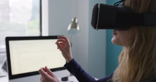 Woman Using Virtual Reality Headset in Office
