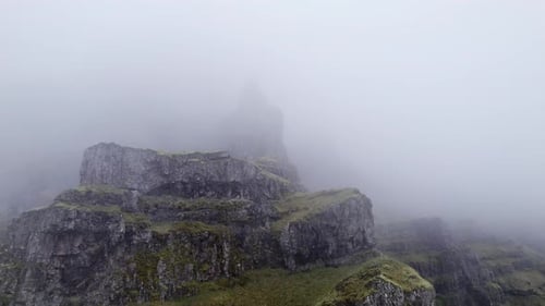 Drone Flight From Mountain Peak In Mist