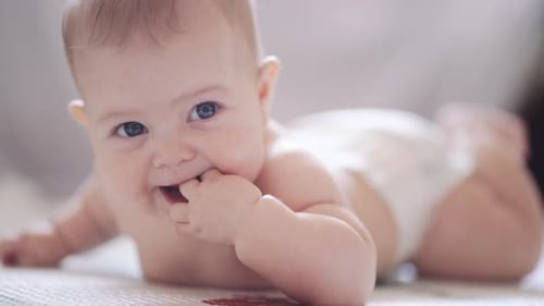 Smiling Baby Lying on Stomach