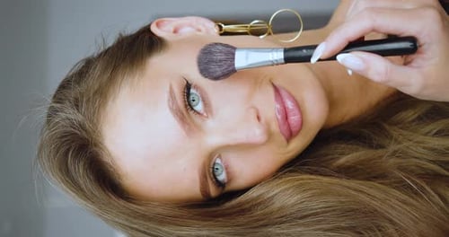 Woman Getting Makeup Applied With Brush, Close-Up