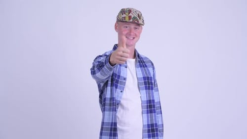 Happy Young Handsome Hipster Man Pointing at Camera