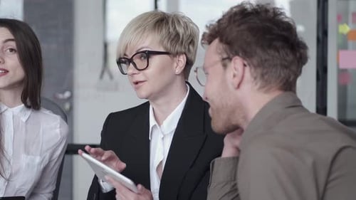 Collegues Are Discussing Ideas for a Project in the Office