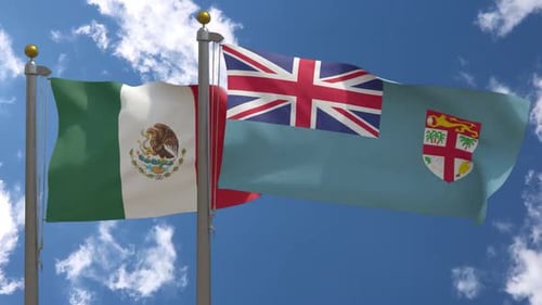 Mexico and Fiji National Flags Waving on Flagpoles
