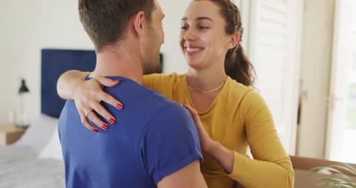 Loving Couple Hugging in New Home