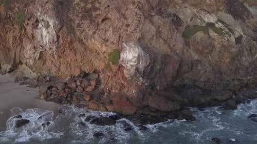 AERIAL: Flight Over Malibu, California View of Beach Shore Line Pacific Ocean at Sunset with