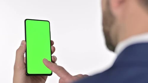 Man Holds Smartphone with Green Screen