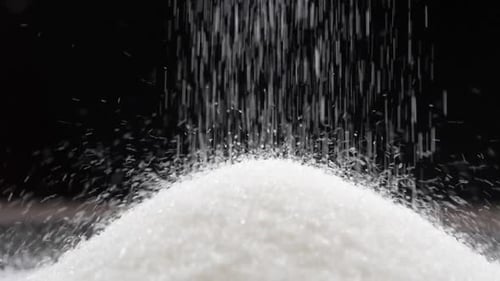 a mound of sugar on a black background