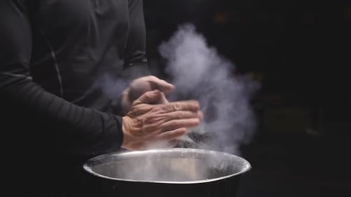 Athlete Man Using Talc Powder Before Workout at Gym