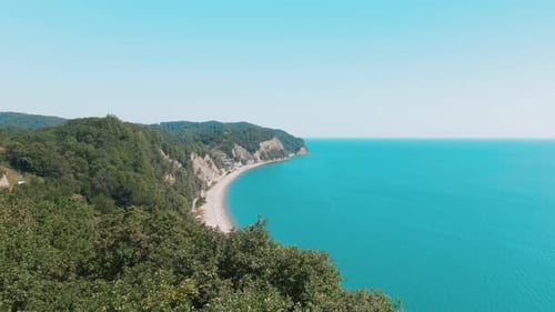 Tropical Beach with Blue-green Sea, Green Mountains of the Rainforest
