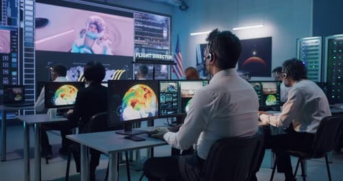 Flight Director Controlling Rocket Launch with Team