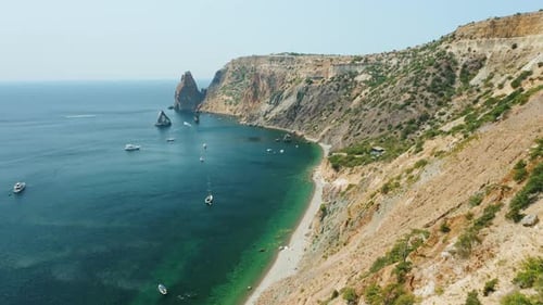 Aerial View of Fiolent Bay Calm Azure Sea and Volcanic Rocky Cliff Shore