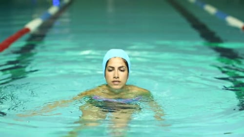Sexy Woman Relaxing In The Swimming Pool