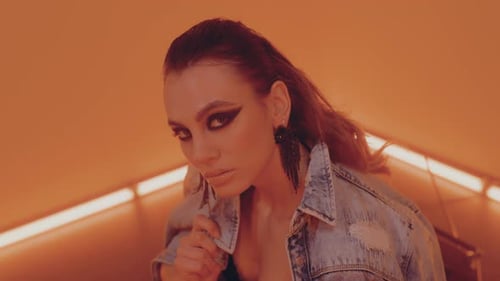 Glamorous Woman with Dark Makeup and Denim Jacket