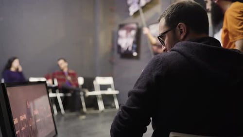 Production Team Works in Office on Editing