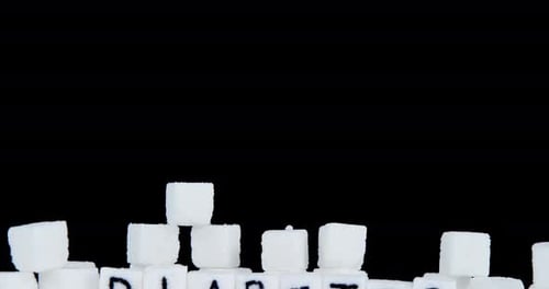 Sugar Cubes Spelling Diabetes On Black Backdrop