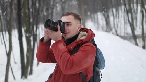 Photographer Taking Photographs in Forest