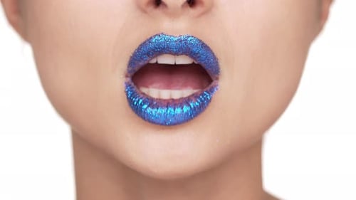 Close-up of Woman's Glittering Blue Lips