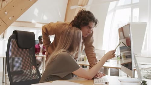 Teamwork in Modern Office: Young Adults Collaborating