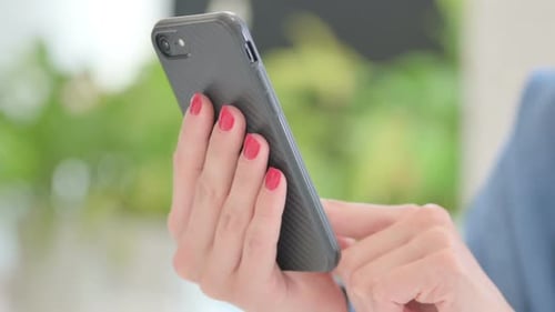Close Up of Woman Browsing on Smartphone