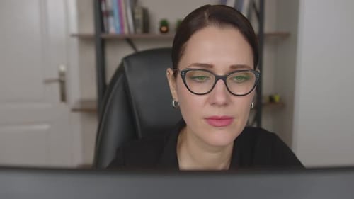 Woman With Glasses Working at Computer