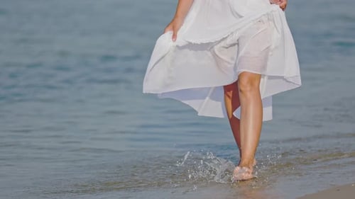 a Woman Walks Barefoot on the Sea