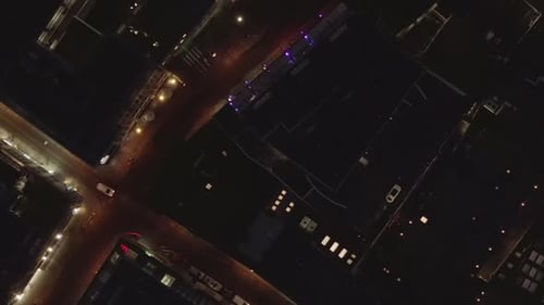 AERIAL: Slow Overhead Shot of City at Night with Lights and Traffic, Cologne, Germany