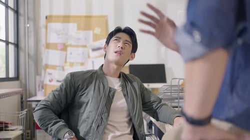 Young Adult Explaining Ideas in Office Environment