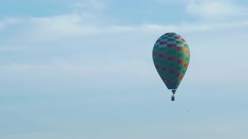 Hot Air Balloon Flying in Cloudy Sky