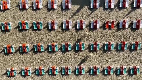 Empty sun loungers on the beach aerial view 4 K Turkey Alanya