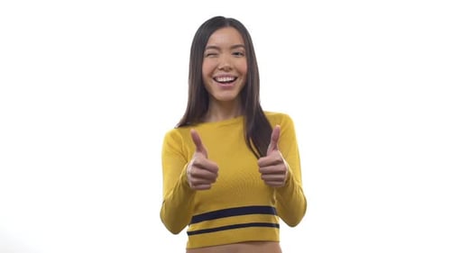 Happy Woman Gives Thumbs Up and Winks