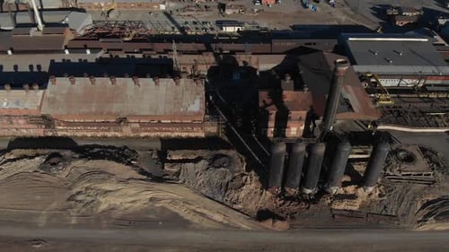 Overhead aerial of antique steel processing facility. Industrial, rusty, with all the sooty goodnes
