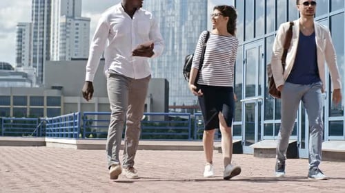 Three People Walking in an Urban Environment