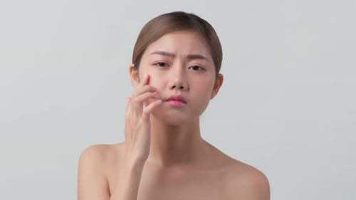 Woman Massaging Face, Close Up