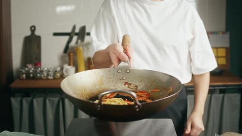 Cooking Noodles in Wok Indoors