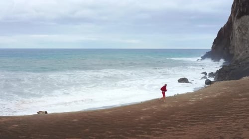 Aerial View of the Sportsman Exercising in Picturesque Coastal Area