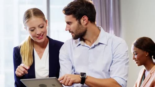 Business People Working Together With Tablet in Office