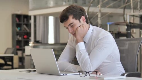 Tired Businessman Sleeping at Work