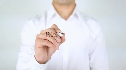 Man Writing Business Administration on Clear Surface