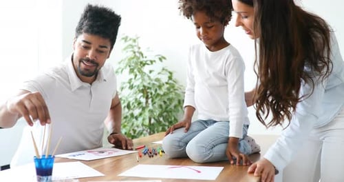 Family Painting Together at Home