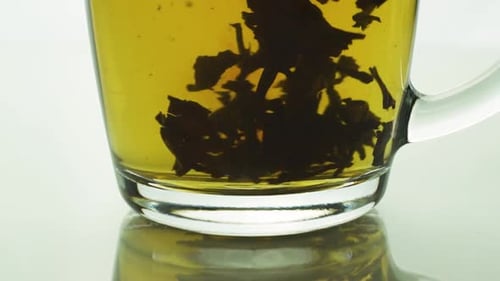 Loose Tea Leaves Steeping in Glass Mug