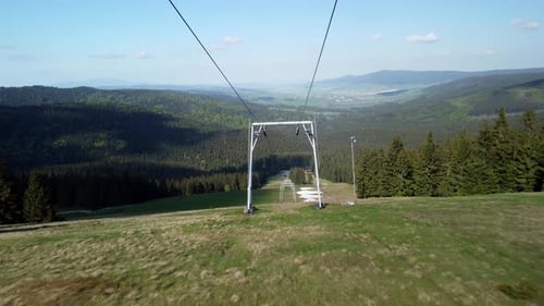 Flying Between the Cable Cars on the Slopes in the Spring
