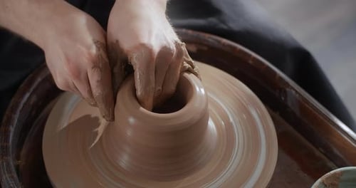 Potter Sculpts a Jug From Red Clay on a Potter's Wheel Pottery Workshop Potter Makes Ceramics in