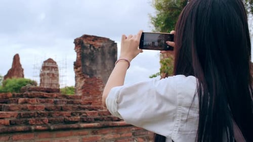 Japanese backpacker female enjoy her journey at amazing landmark in traditional city.
