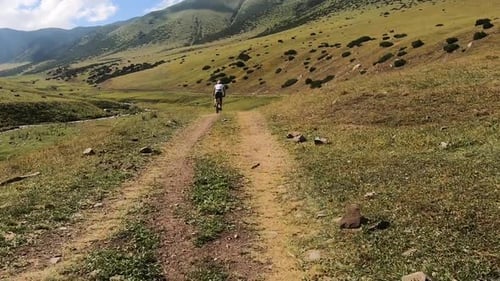 Cyclist Ride Bicycle at Mountain Road