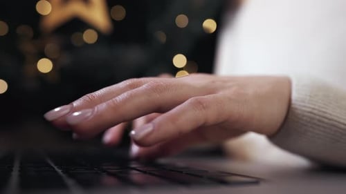 Typing on Laptop at Christmas Time