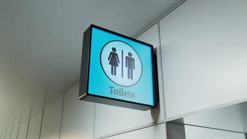 Zooming-in view at the toilets sign. Airport hall. Restroom. Man. Woman. 4k HD