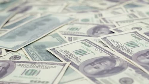 Many Dollar Bills Rotate in Closeup