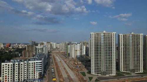 Construction of a modern city block. Multi-storey buildings