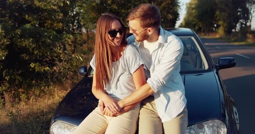 Loving Couple Embrace on Car Journey